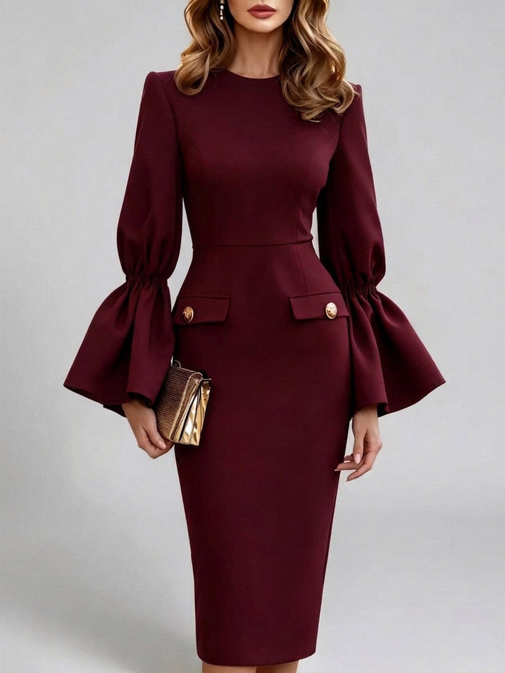 Burgundy fitted dress with gathered sleeves that open into wide bell cuffs