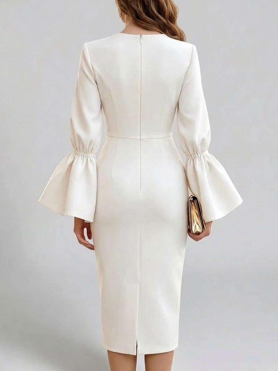 Back view of the ivory dress showing the center zip and back slit