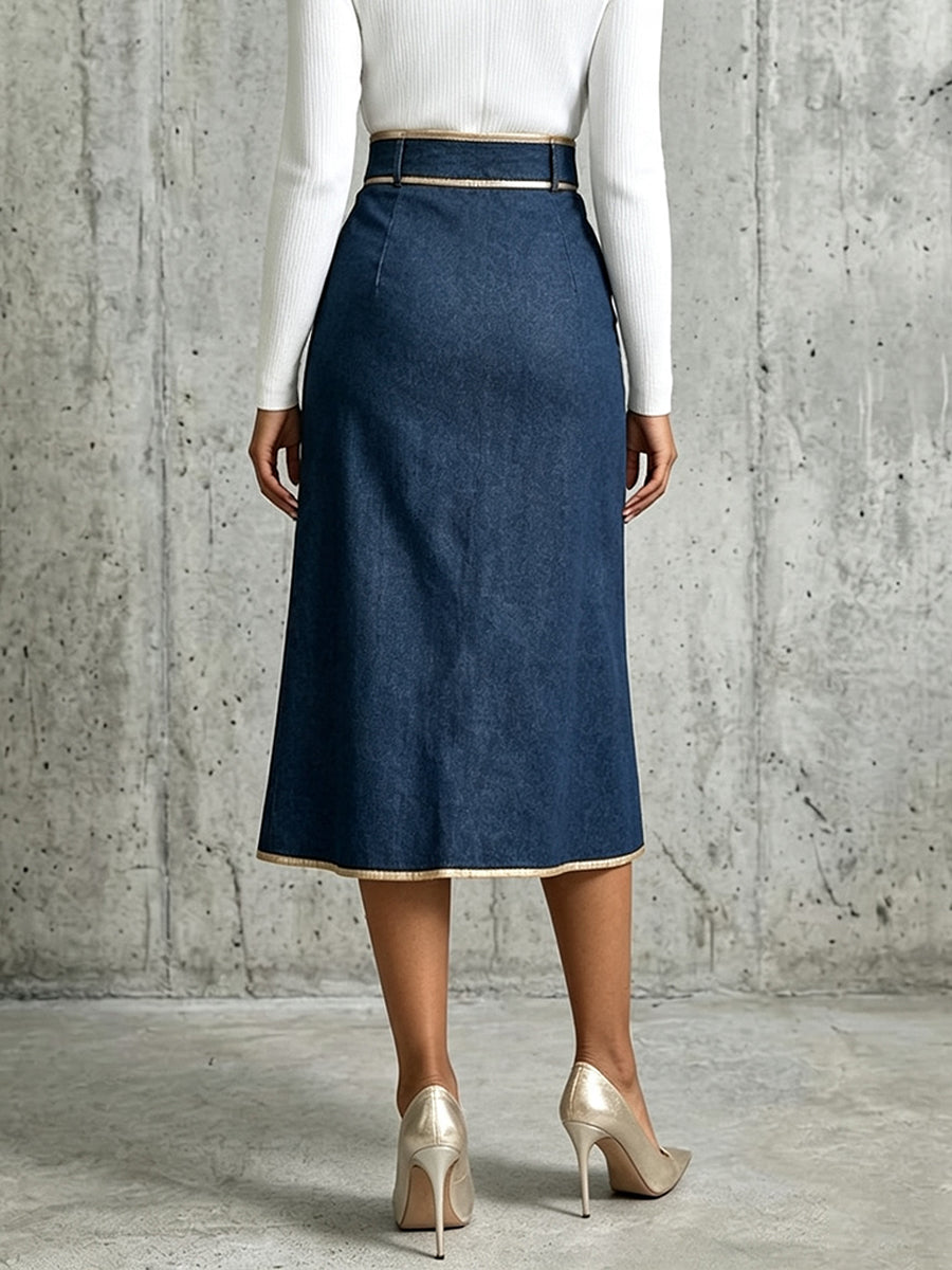 Back view of the dark blue midi skirt with gold-tone piping at the hem
