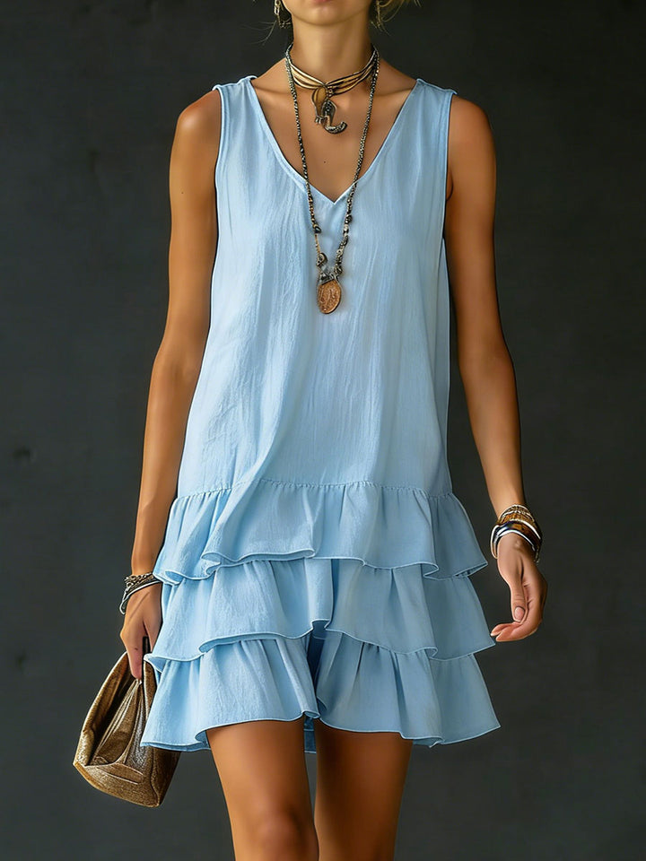Light blue mini dress with V neck and swingy tiered skirt