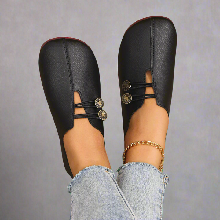 Black soft moccasins with button laces