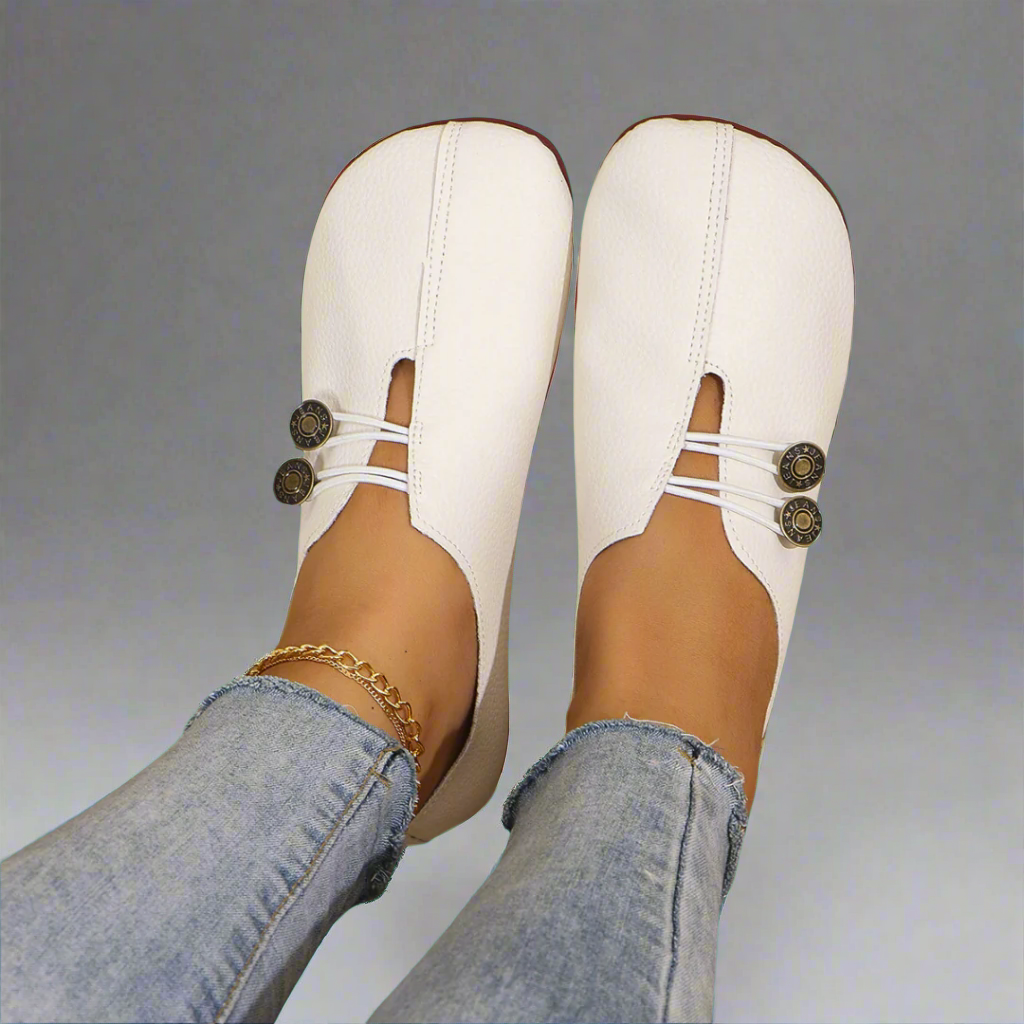 White barefoot style moccasins with button laces