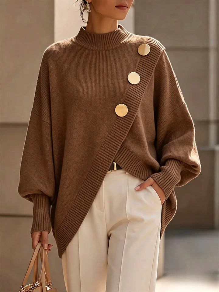 Brown oversized mock neck sweater with asymmetrical gold buttons on a model, front view