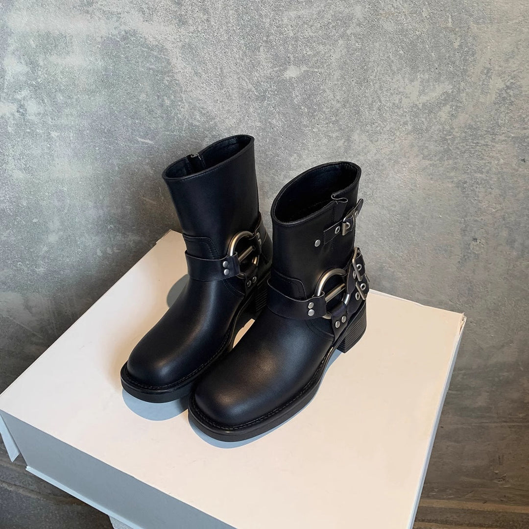 Women's motorcycle boots in black, ankle height with buckle straps and ring hardware