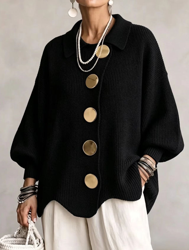 Black oversized collared cardigan with large gold buttons and scalloped hem