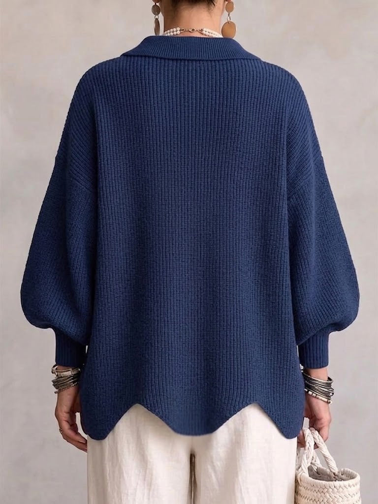 Back view of the navy oversized cardigan with ribbed knit and wavy hem