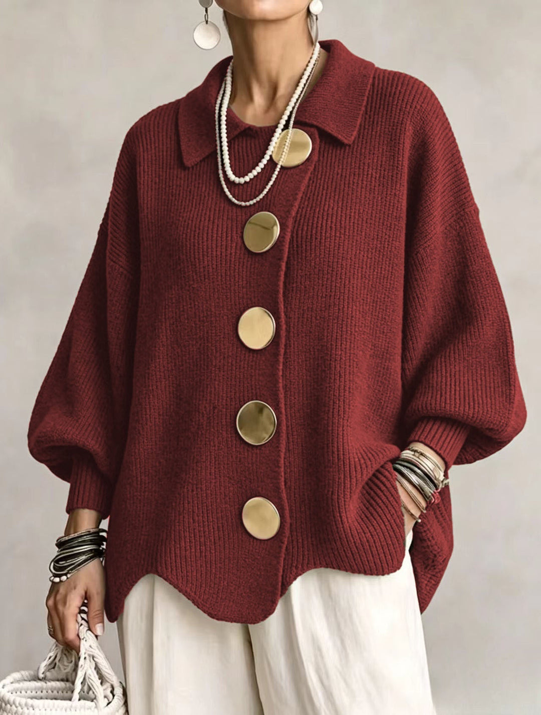 Red oversized cardigan with round gold buttons and balloon sleeves