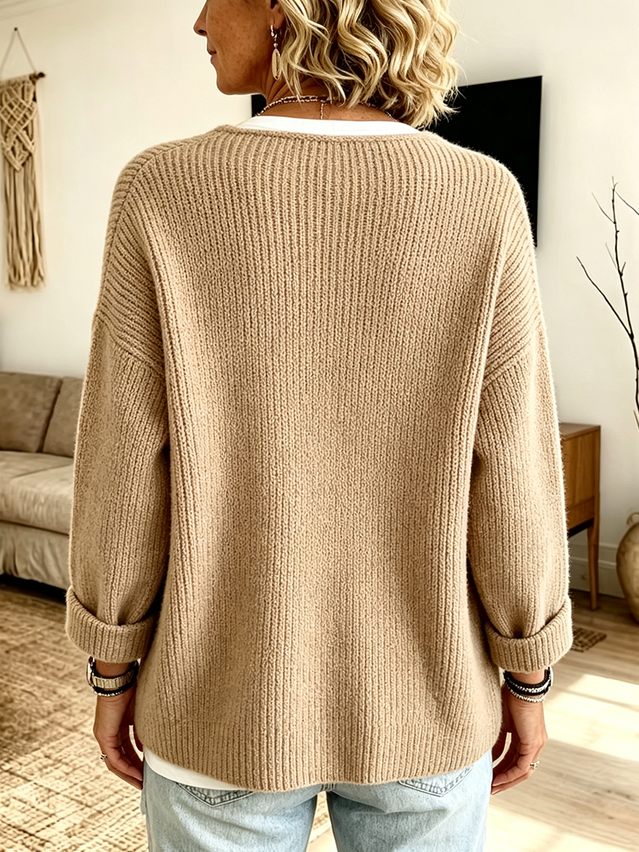Back of the camel cardigan showing dropped shoulders and turned-up cuffs