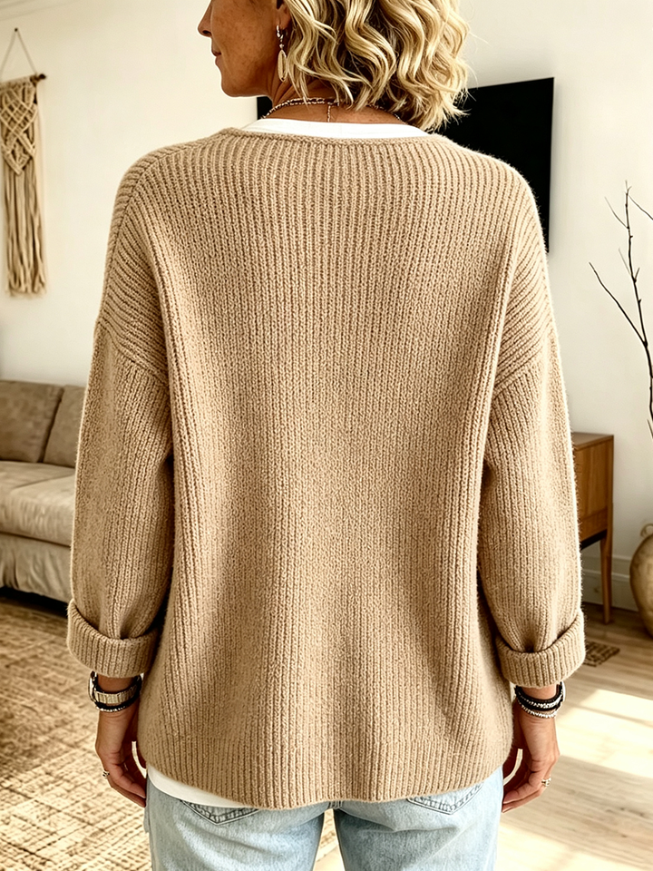 Back of the camel cardigan showing dropped shoulders and turned-up cuffs