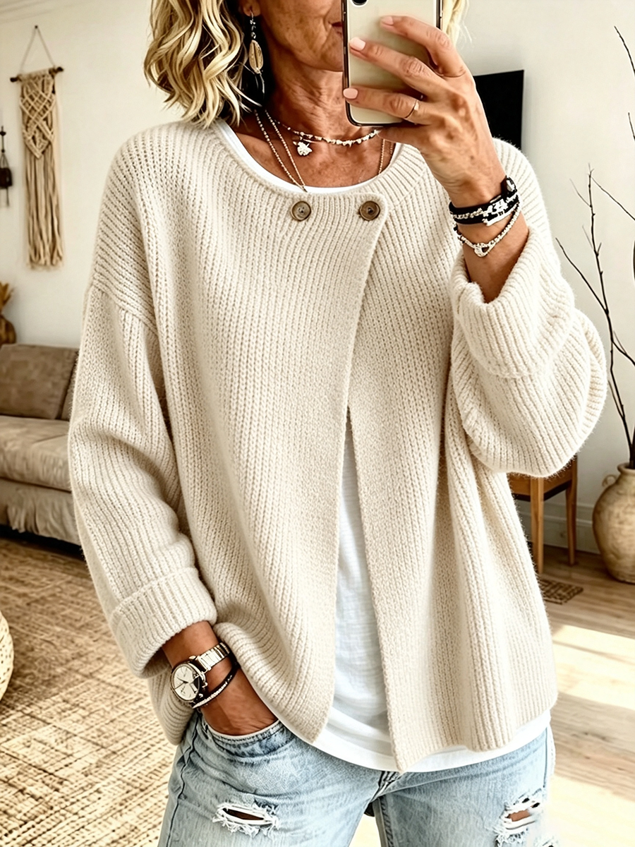 Cream oversized cardigan with one button at the neck and curved hem