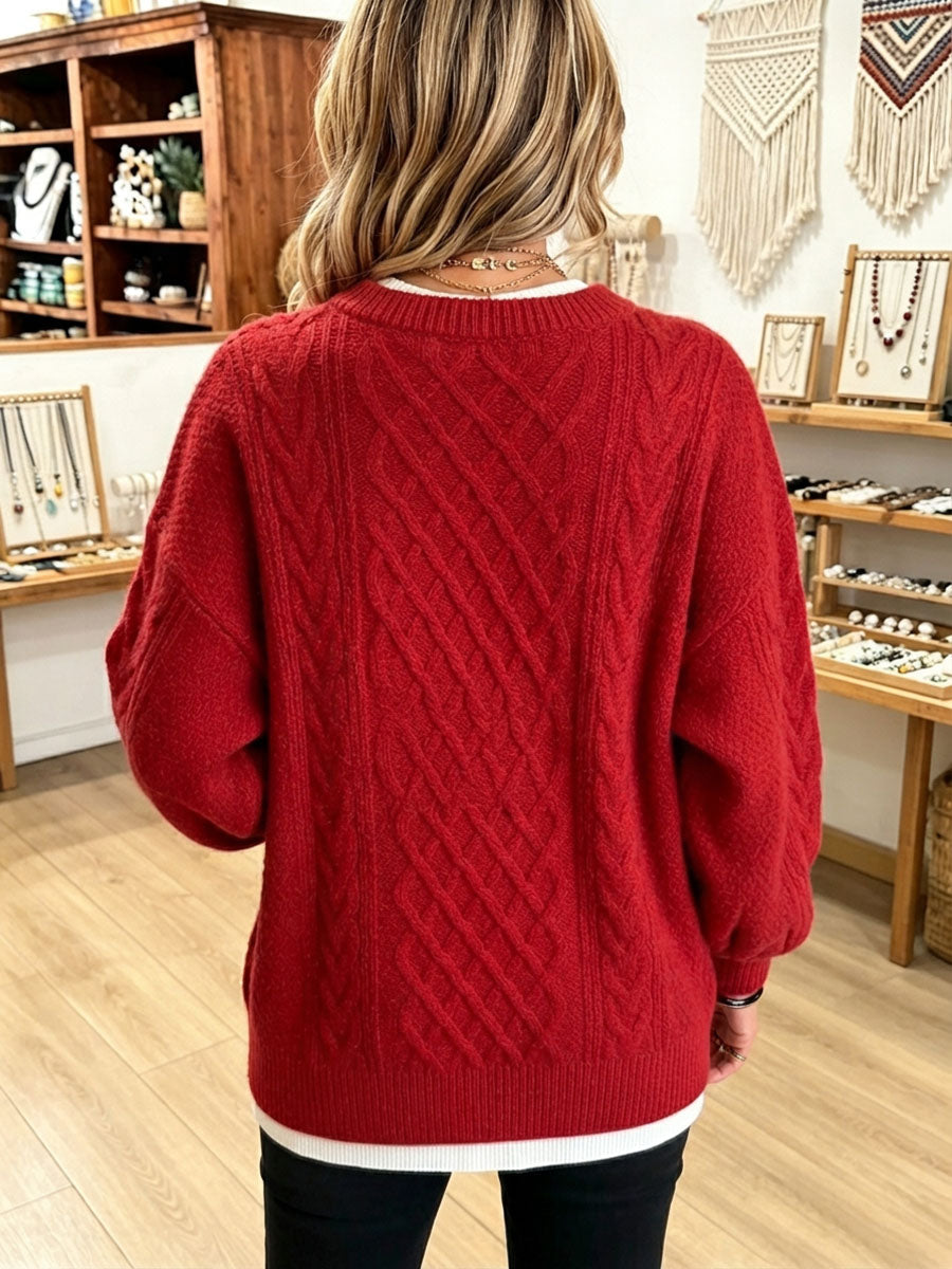 Back view of the red cable knit sweater with dropped shoulders