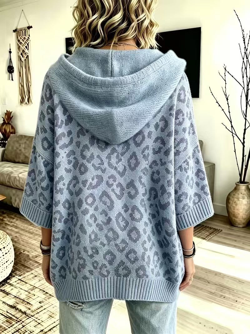 Back view of the dusty blue hooded sweater with ribbed hem