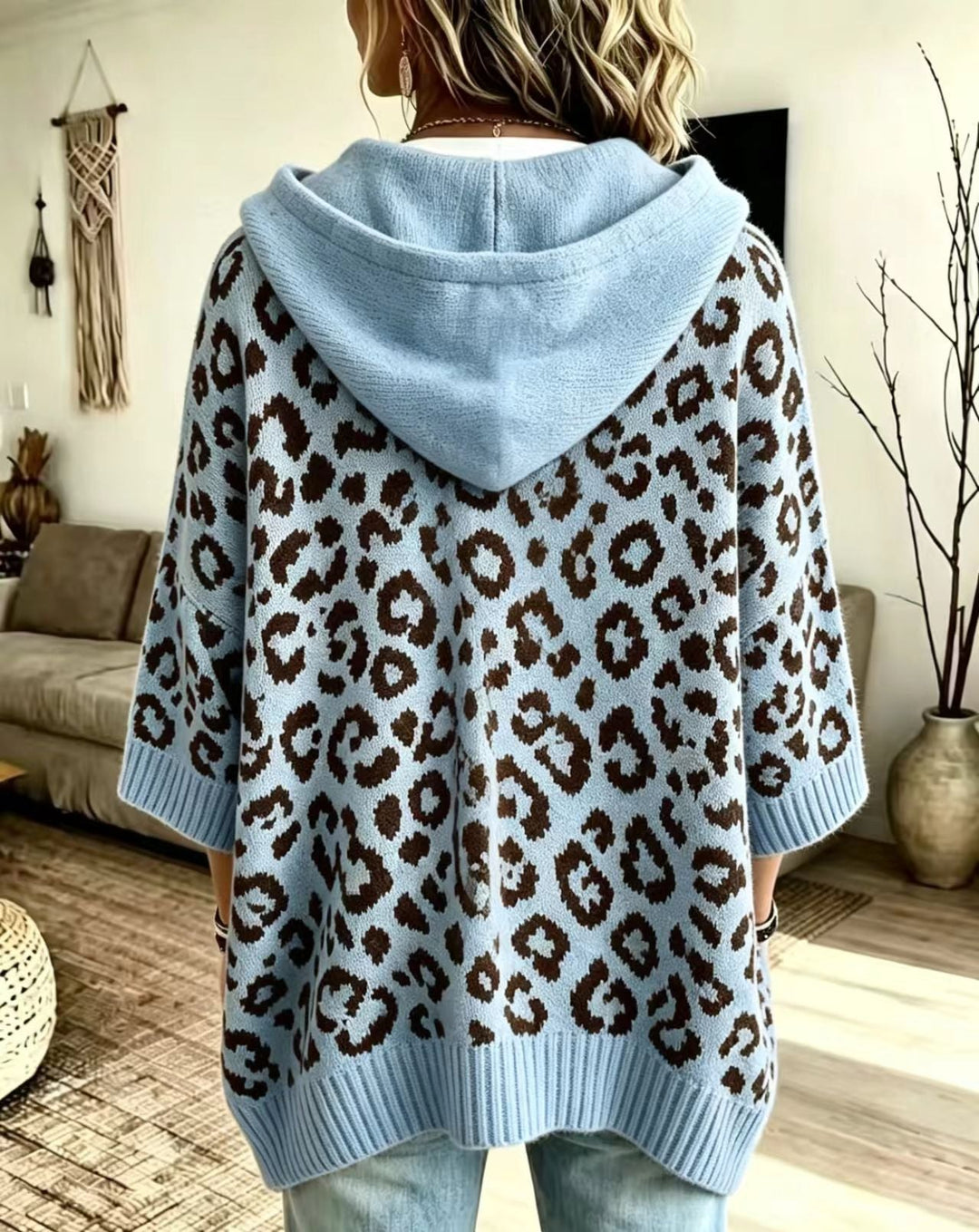 Sky blue leopard sweater from the back with a relaxed batwing shape