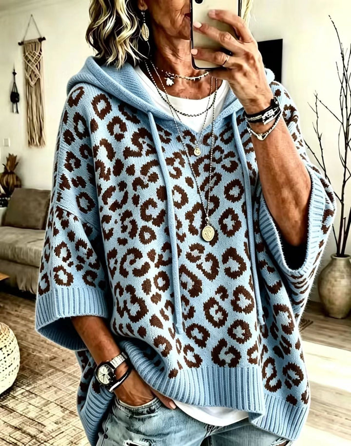 Sky blue hooded sweater with brown leopard spots and long drawstrings