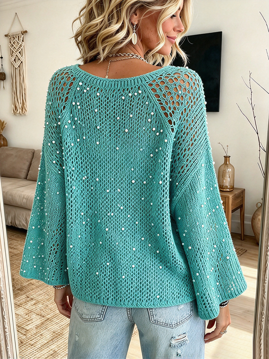 Back view of the teal sweater with raglan seams and wide sleeves