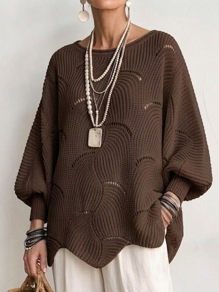 Brown openwork knit sweater with a simple round neckline