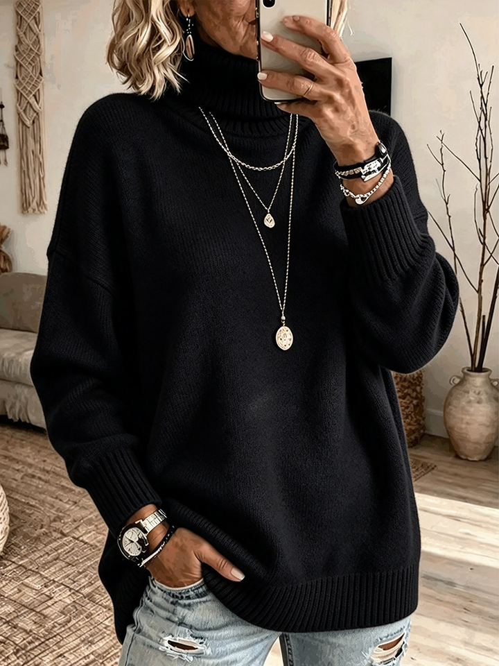 Black oversized turtleneck sweater with deep ribbed hem