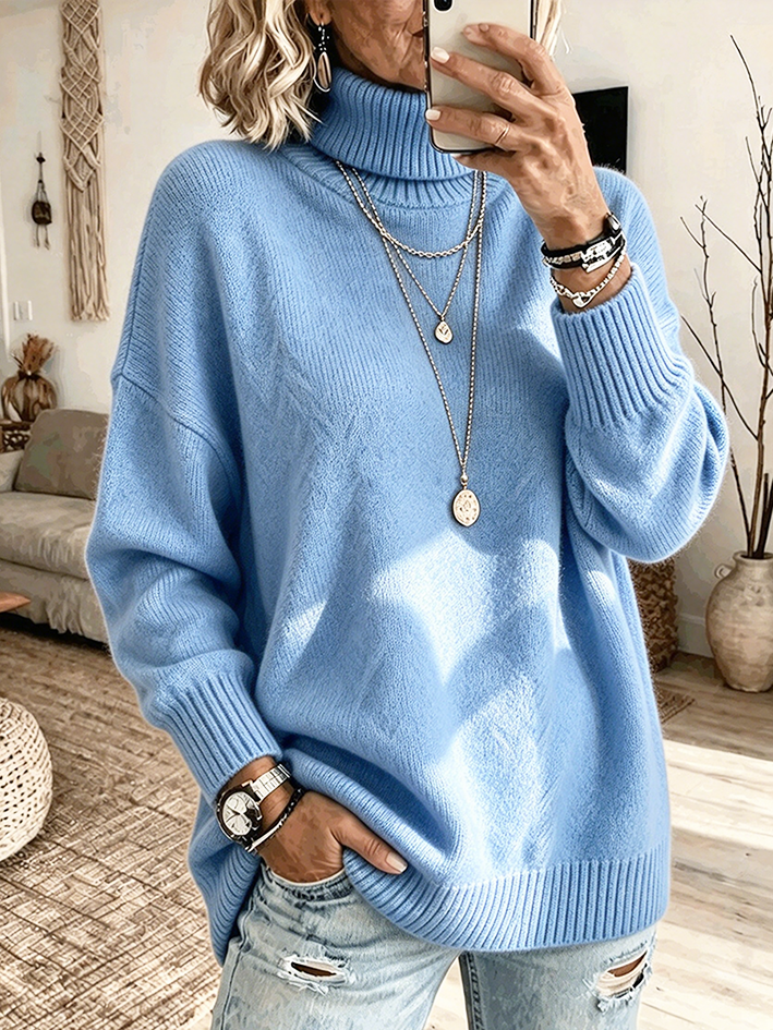 Light blue roomy sweater with fold-over collar and long sleeves
