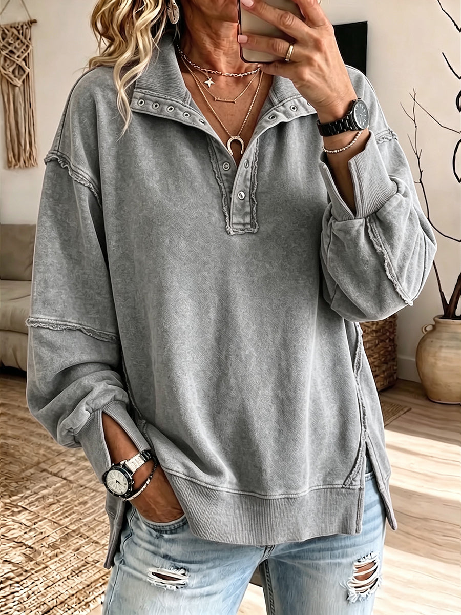 Gray henley pullover with ribbed hem and split cuffs at the wrist