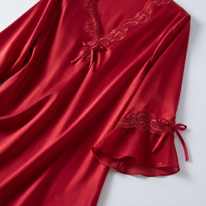 Close-up of the red V neck with lace trim and sleeve detail