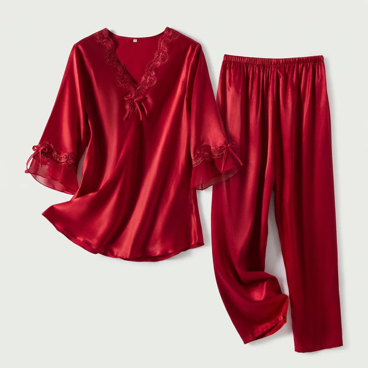 Red satin-look pajama top and pants laid flat