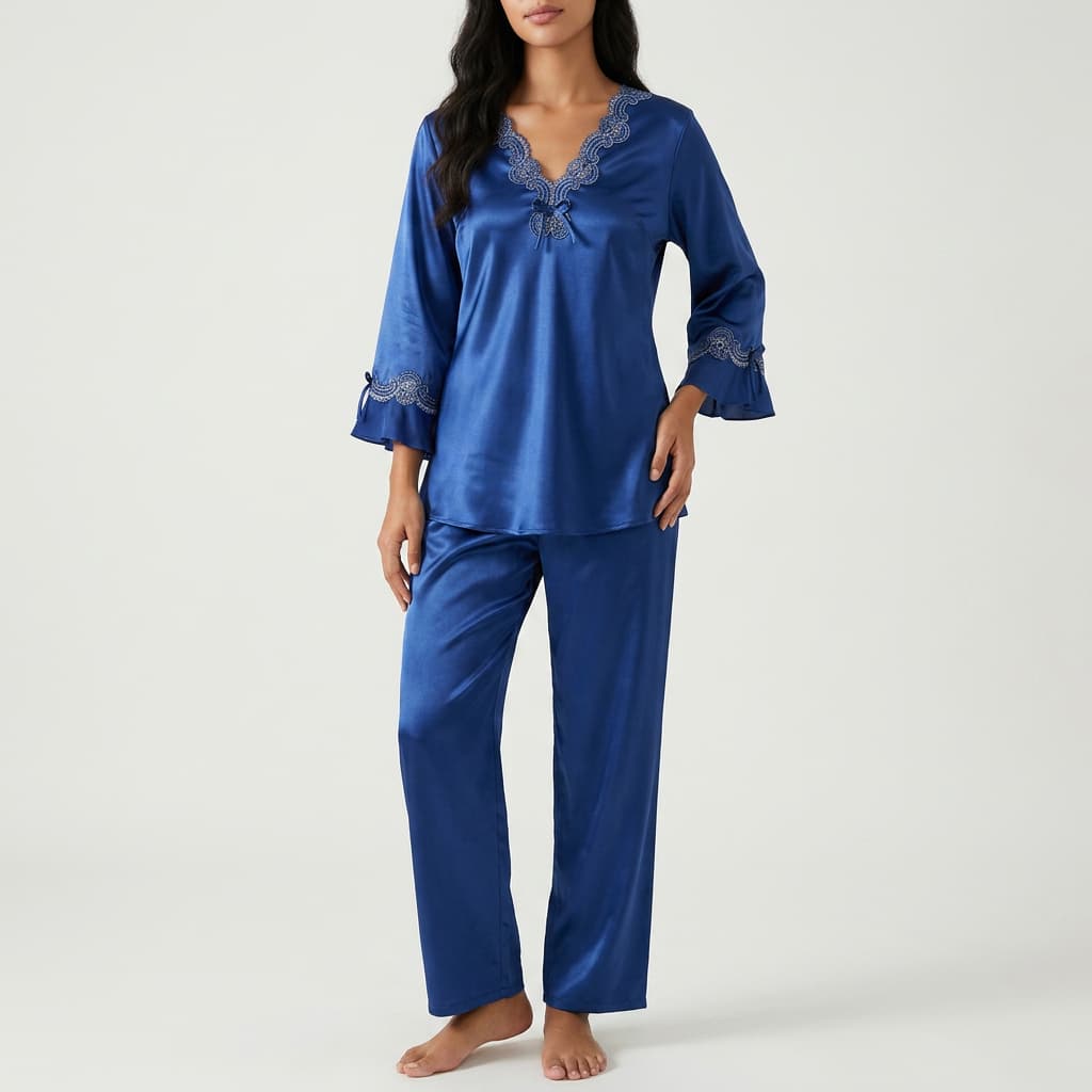 Woman wearing the royal blue satin-look pajama set with lace trim, front view