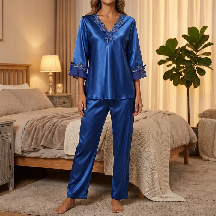 Royal blue satin-look pajama set worn in a cozy bedroom