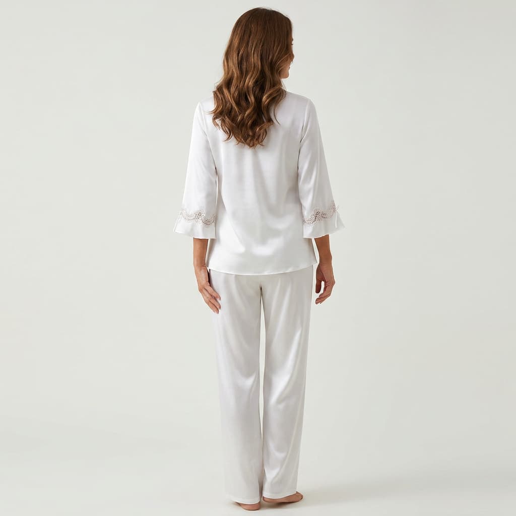 Back view of the white satin-look pajama set on a model