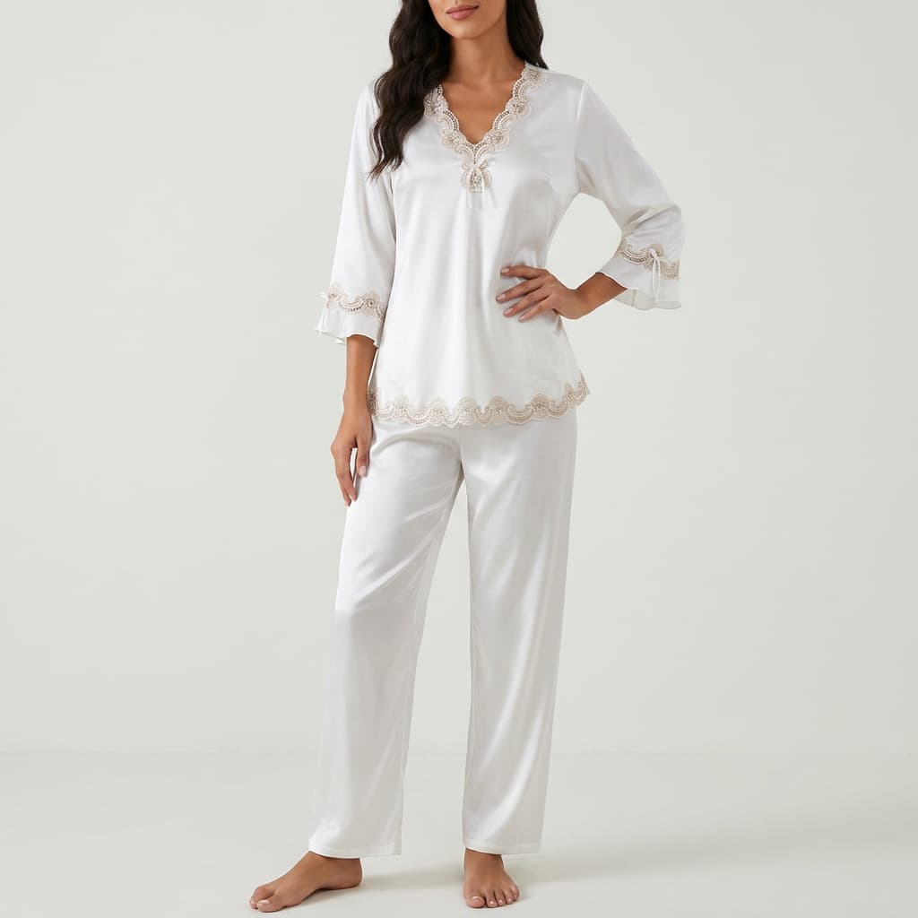 Woman wearing the white satin-look pajama set with lace trim, front view
