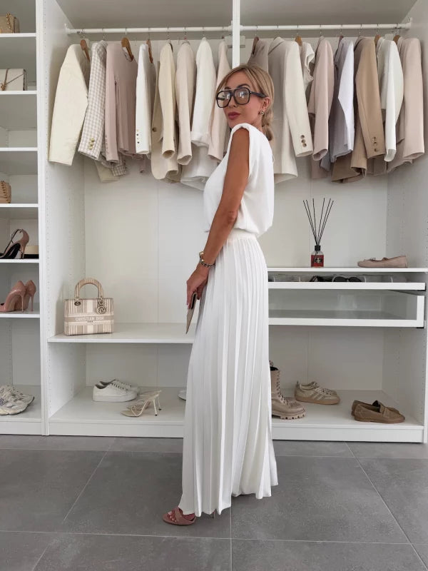White pleated wide leg pants set, side view showing the sleeveless top