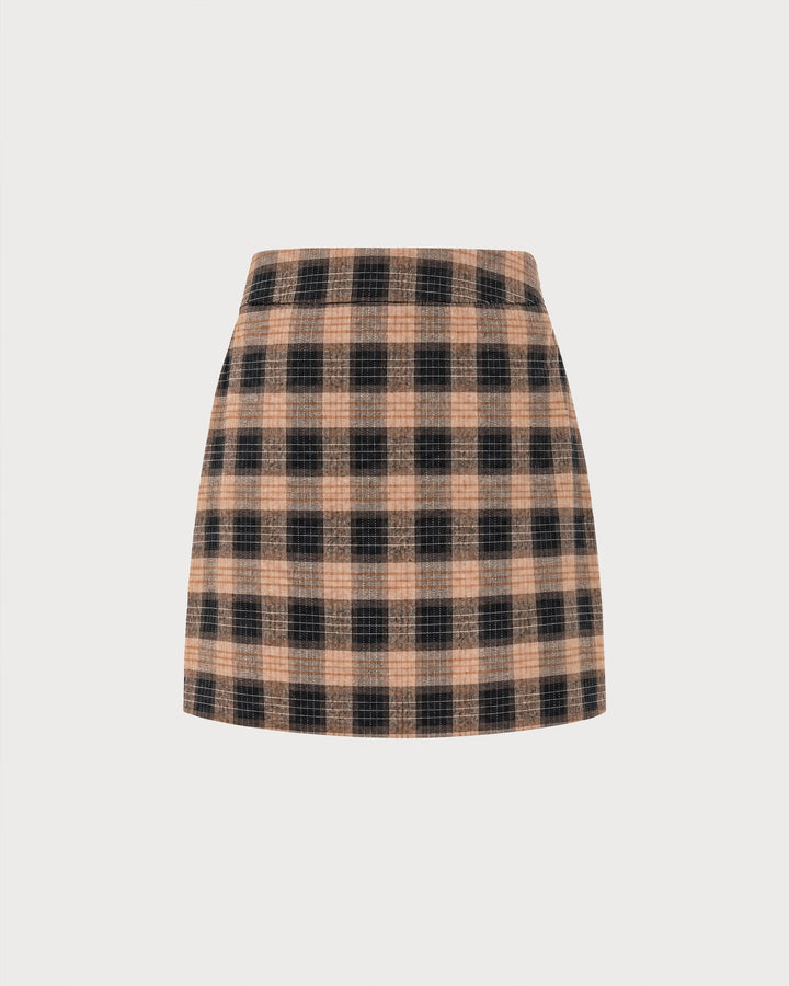 Flat lay of a brown and black plaid A-line mini skirt on a plain background