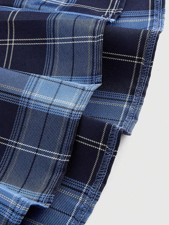 Close-up of the blue plaid pleats and fabric folds