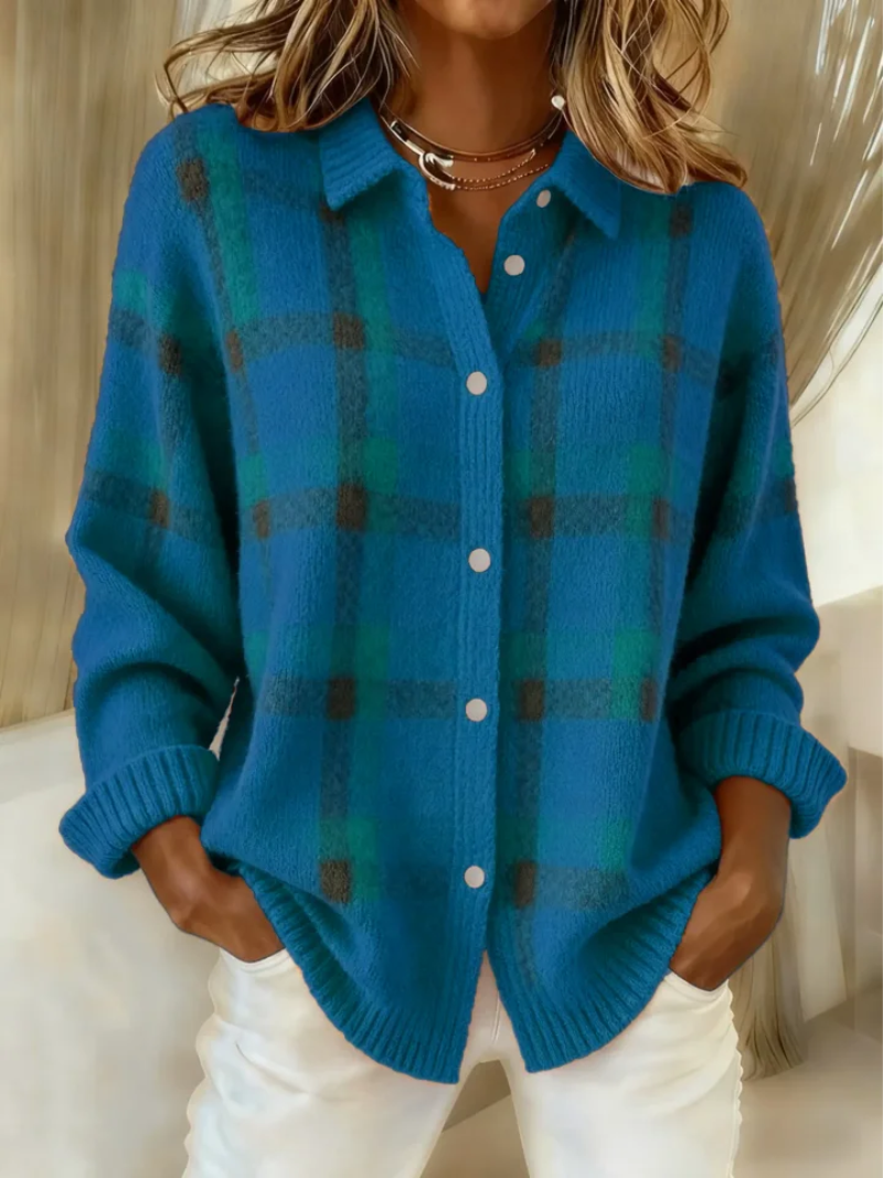 Blue plaid collared button up shacket, worn open at the hem over white pants