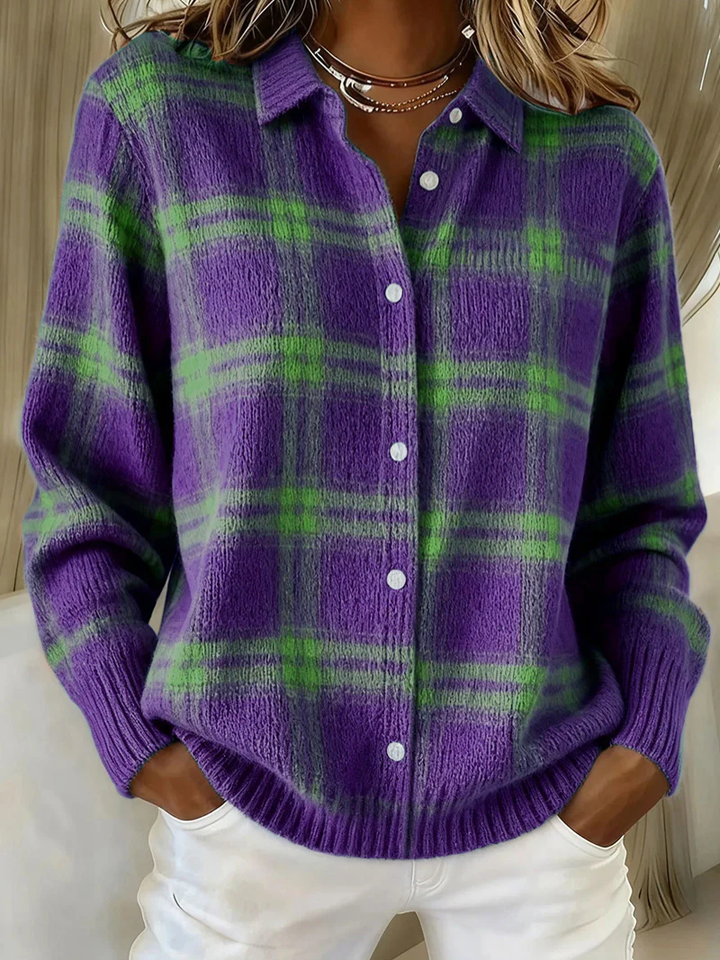 Purple and green plaid knit shacket with collar and button front, hands in pockets