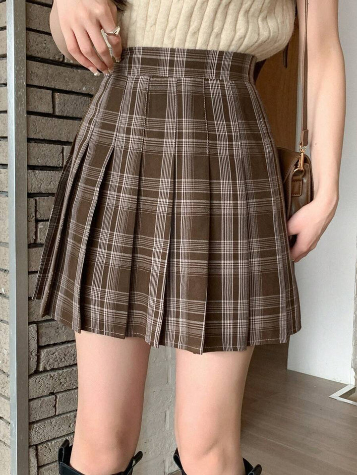 Side view of the pleated plaid mini skirt showing the pleat detail