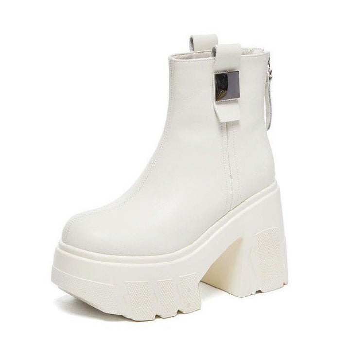 Off white platform ankle boot with chunky lug sole, block heel and back tab on a white background