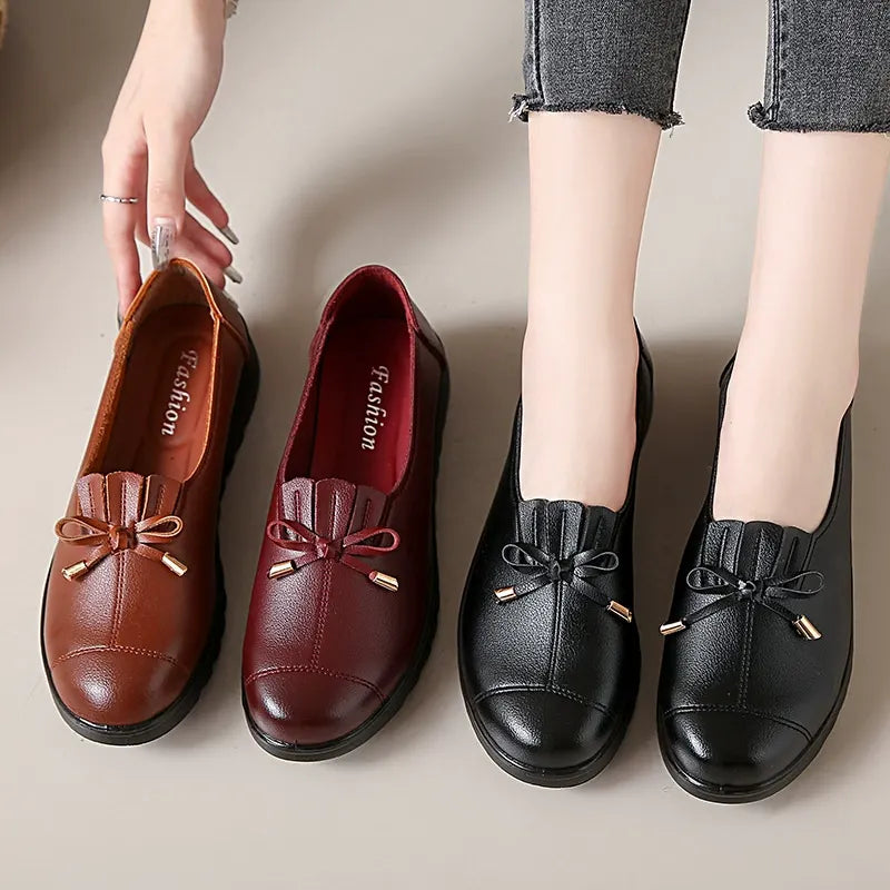 Platform loafers with bow and fringe in cognac, burgundy and black, side by side