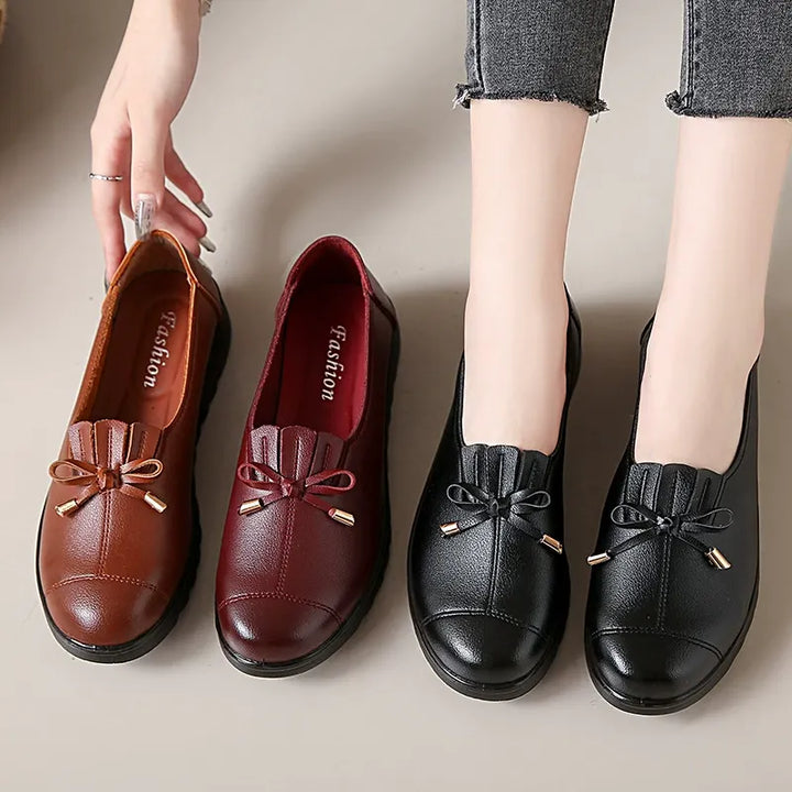 Platform loafers with bow and fringe in cognac, burgundy and black, side by side