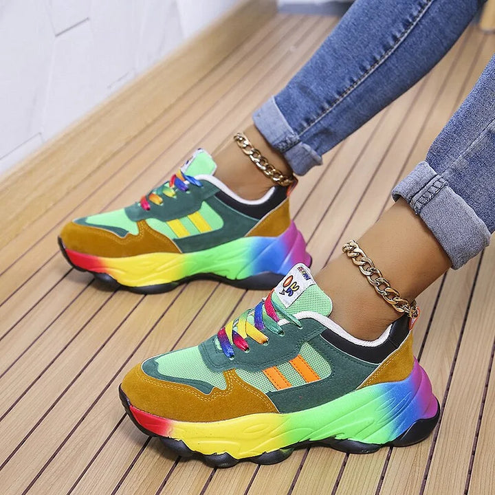 Side view of green multi sneakers with rainbow gradient platform sole