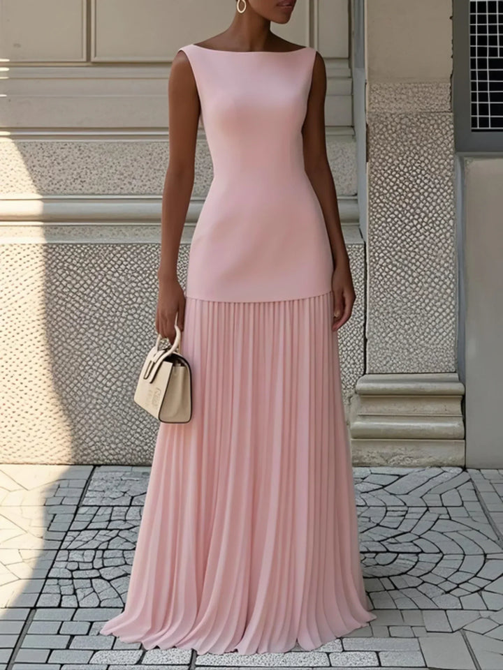 Pink sleeveless pleated maxi dress with boat neck and flowing skirt