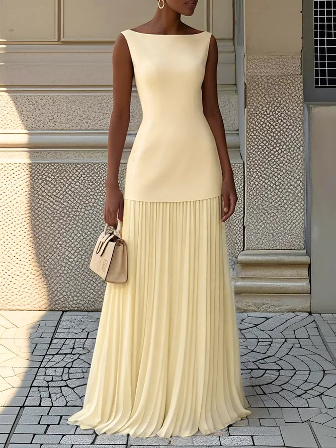 Pale yellow pleated maxi dress with drop waist, sleeveless boat neck design