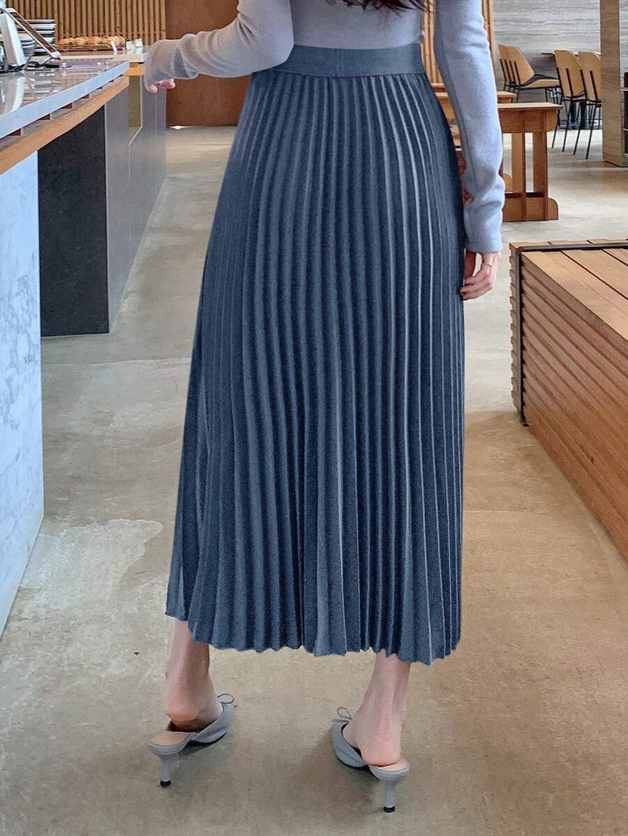 Slate blue high waist pleated maxi skirt, front view with pointed flats