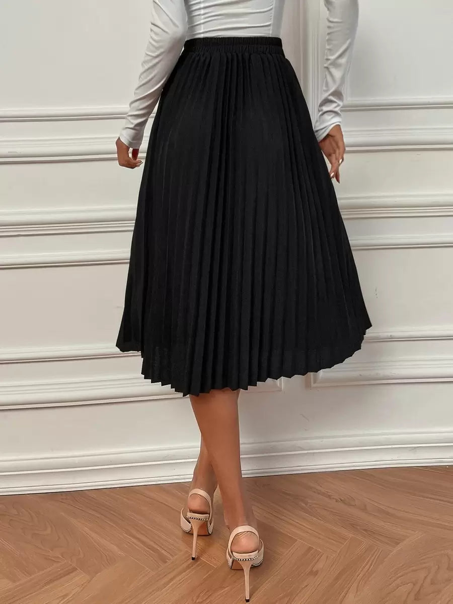 Black pleated skirt in a flared midi length, back view