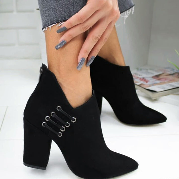 Black suede-look ankle boot with V-cut ankle line and side eyelet lacing