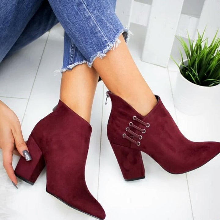 Side view of burgundy booties showing the sturdy block heel