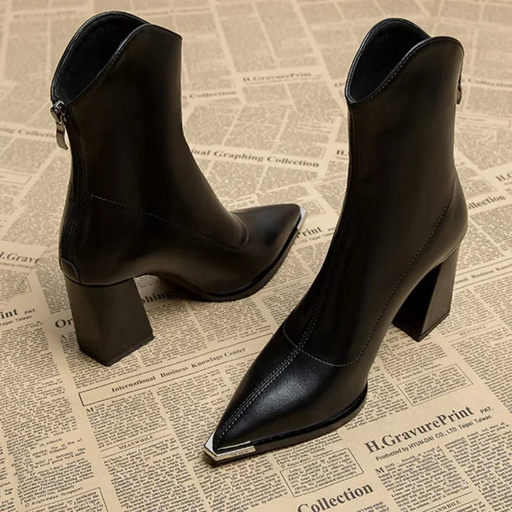 Black pointed toe block heel ankle boots with metal tip, side and front view