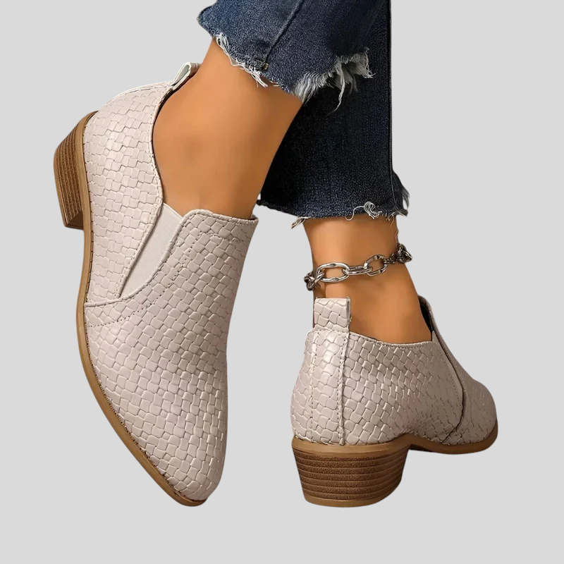 Beige woven ankle booties from the side and back showing the low block heel