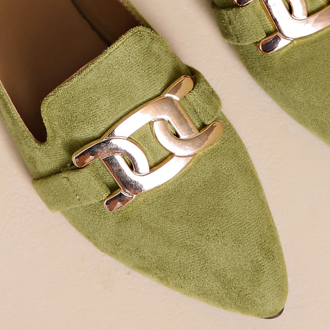 Close-up of the gold chain buckle on an olive suede look loafer