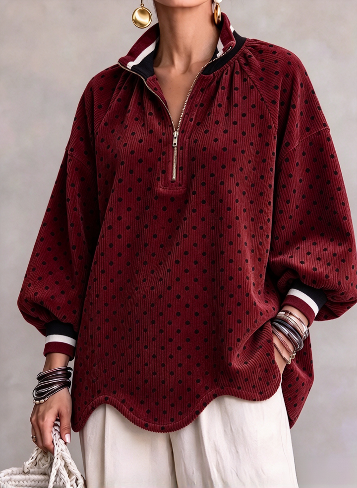 Red polka dot pullover with scalloped hem