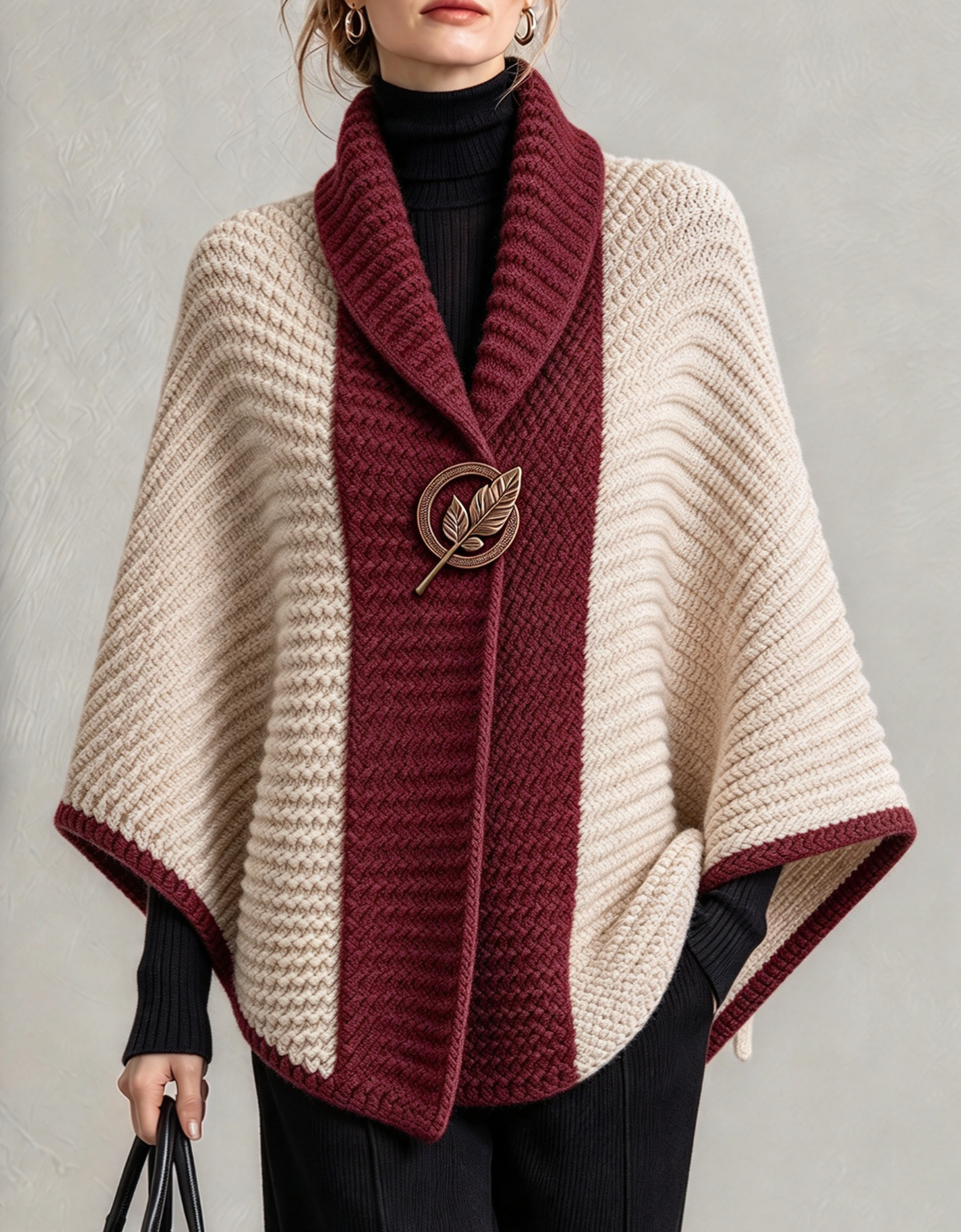 Burgundy and cream knit cape with brooch